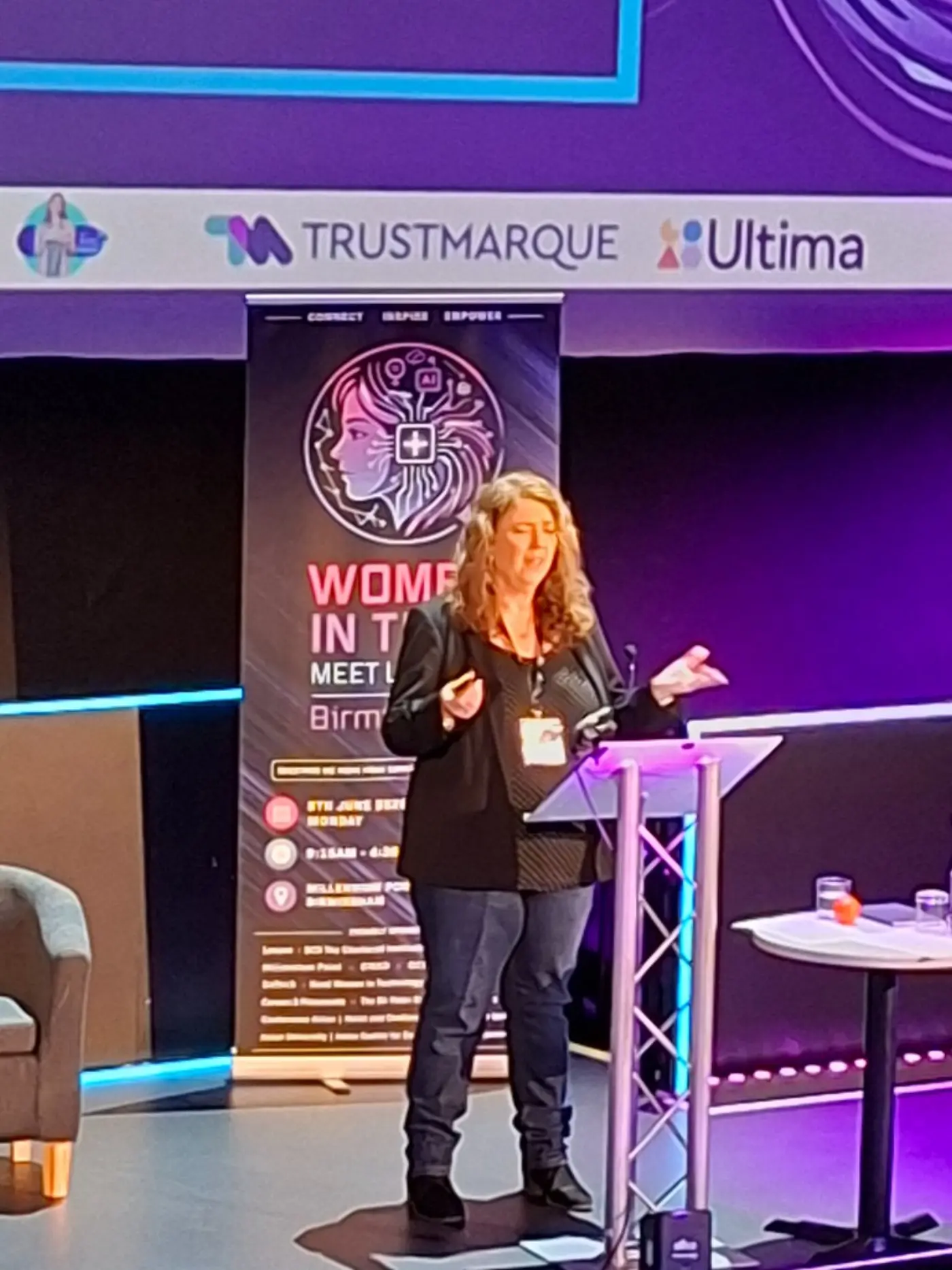 Kathryn Baddeley speaking on stage at Women in Tech Meet Up 2026