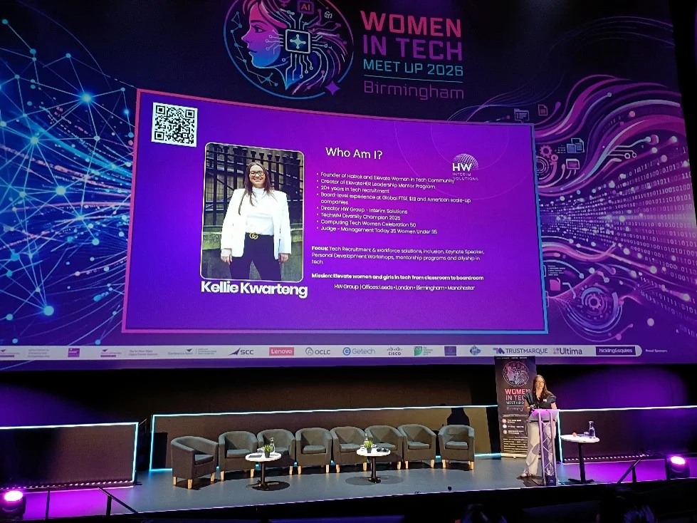Kellie Kwarteng speaking on stage at Women in Tech Meet Up 2026