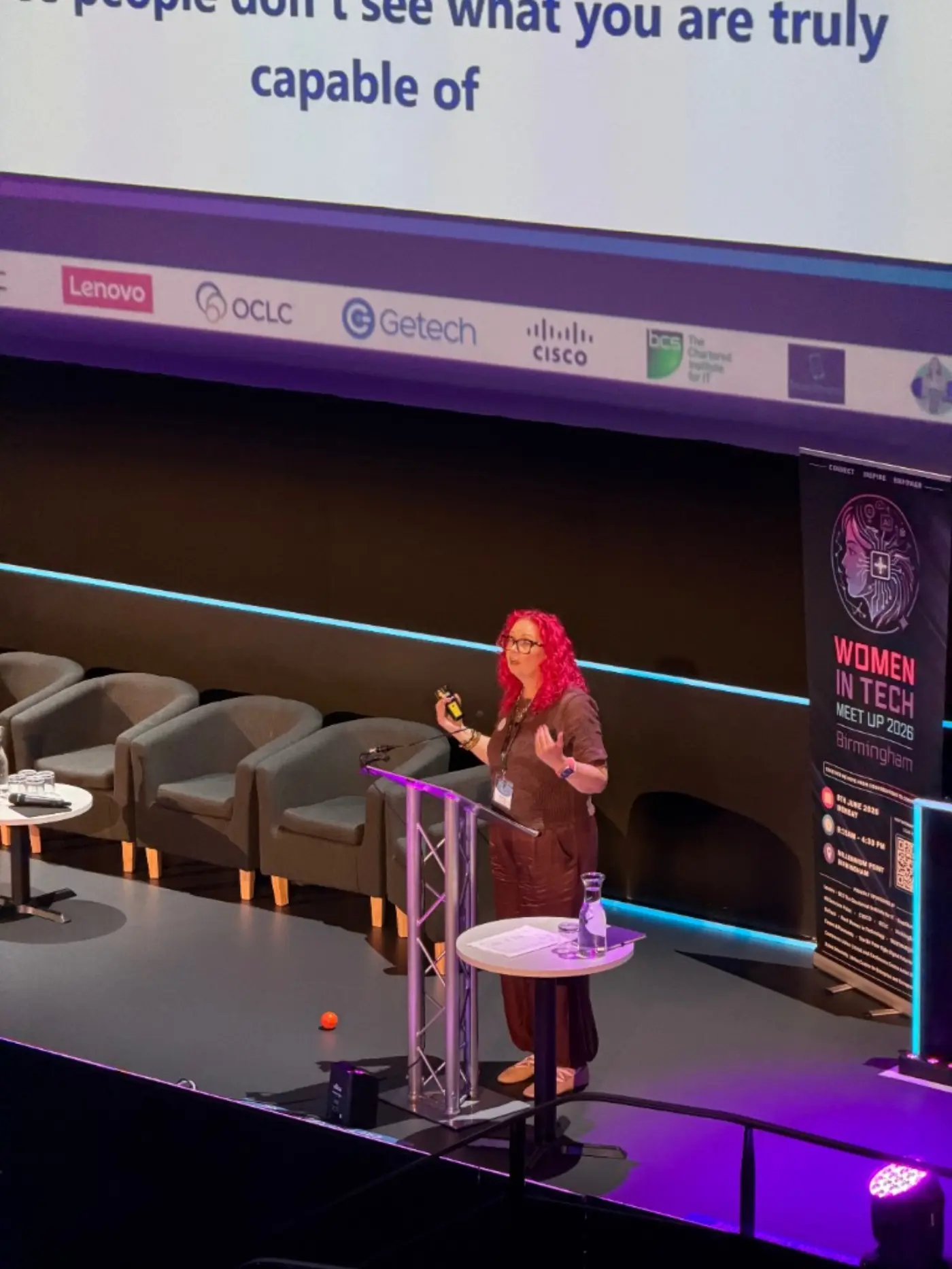 Susan O’Connor speaking on stage at Women in Tech Meet Up 2026